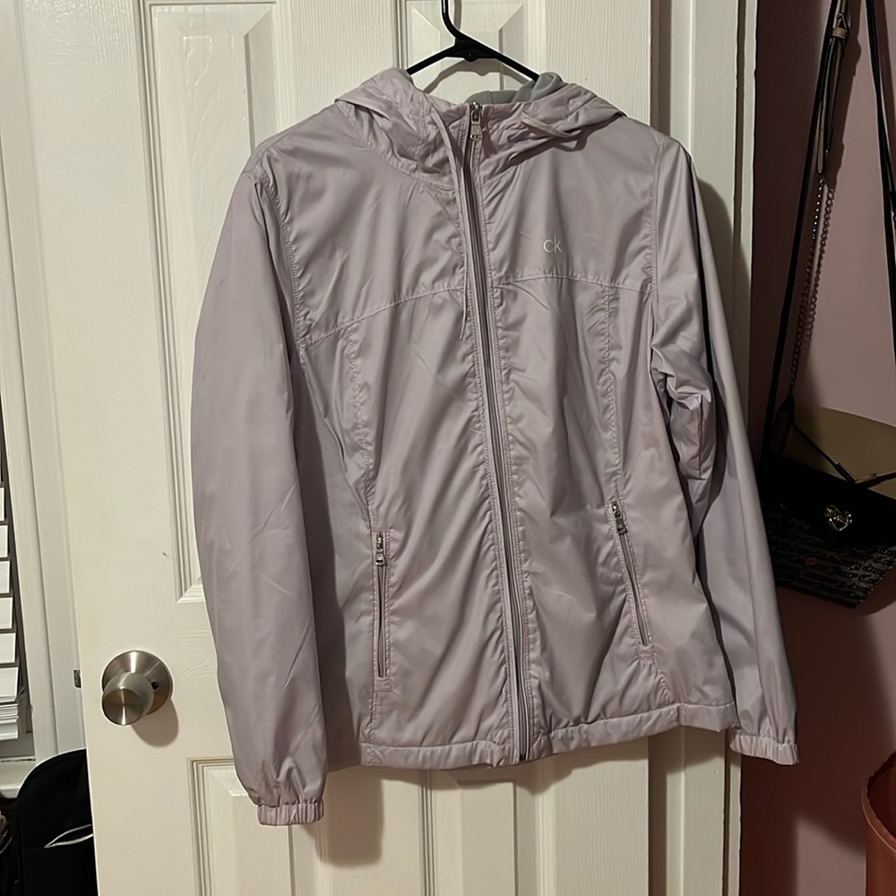 Calvin Klein size S wore three times has like some yellow stains in the zipper.